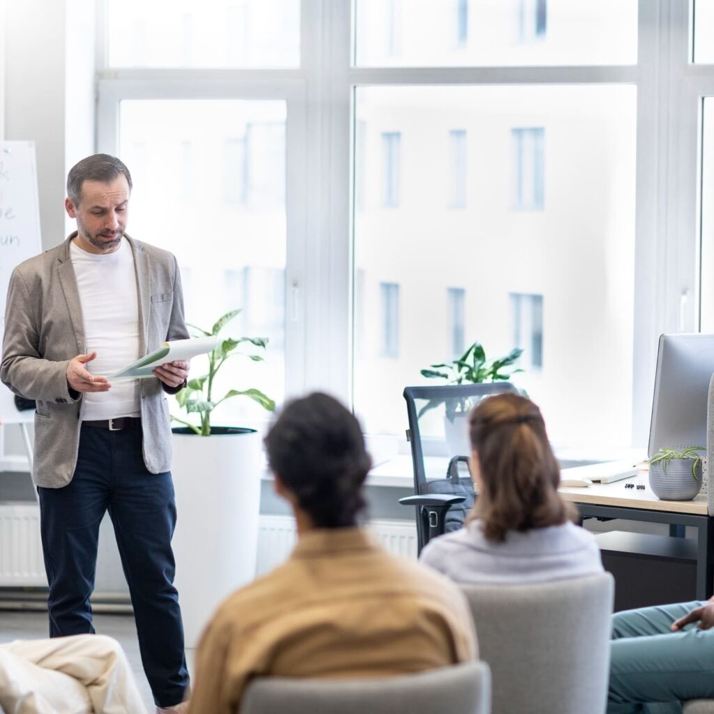 male business trainer giving lecture